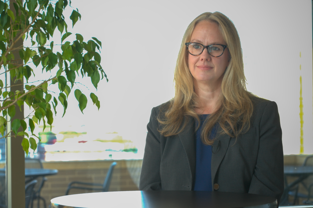 Senior Measurement Scientist Monica Cuddy, PhD smiling at camera