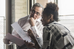faculty member provides feedback on formative assessment to medical student