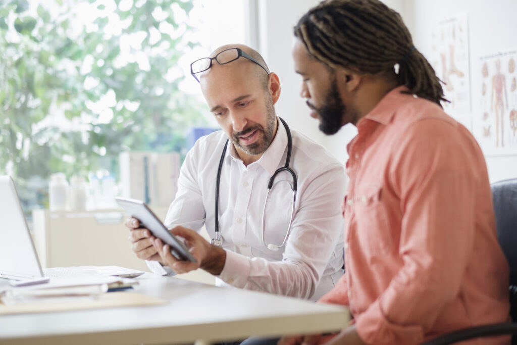 faculty member providing feedback to medical student